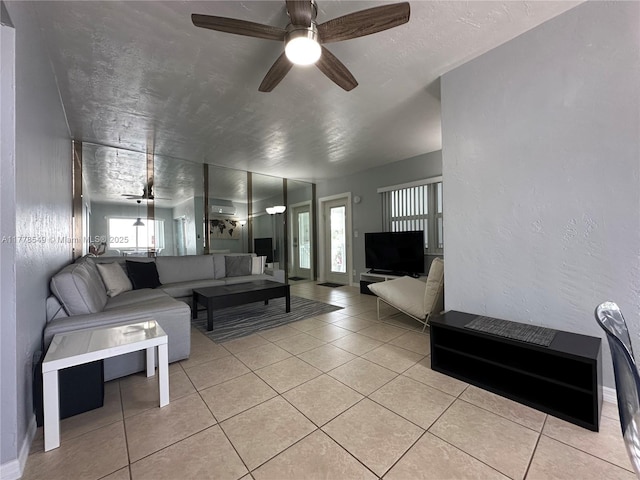 801 Atlantic Shores Blvd Unit 203, Hallandale Beach, FL 33009 - living room featuring ceiling fan, tile patterned flooring, and baseboards