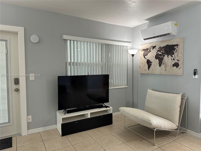 801 Atlantic Shores Blvd Unit 203, Hallandale Beach, FL 33009 - sitting room with a wall mounted air conditioner, tile patterned floors, and baseboards