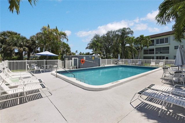 4200 Crystal Lake Dr Unit 303, Deerfield Beach, FL 33064 - community pool with a patio area and fence