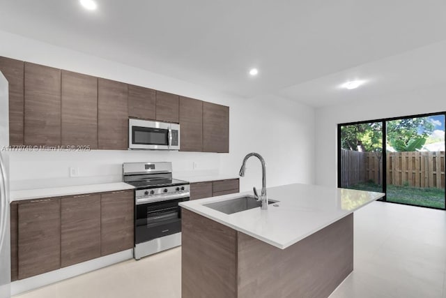 34441 SW 189th Ct, Homestead, FL 33034 - kitchen featuring appliances with stainless steel finishes, a sink, light countertops, modern cabinets, and recessed lighting