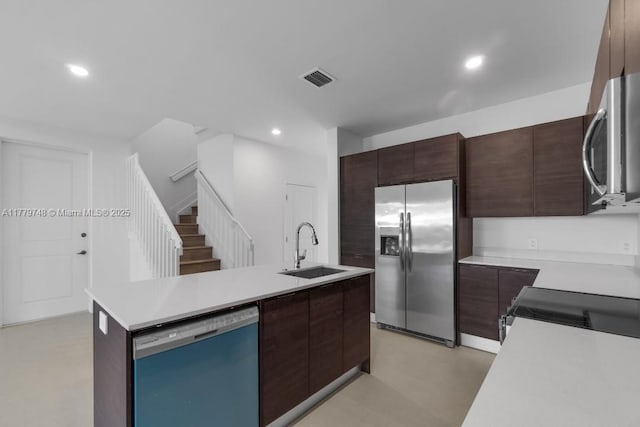 34441 SW 189th Ct, Homestead, FL 33034 - kitchen featuring stainless steel appliances, a sink, light countertops, recessed lighting, and dark brown cabinets
