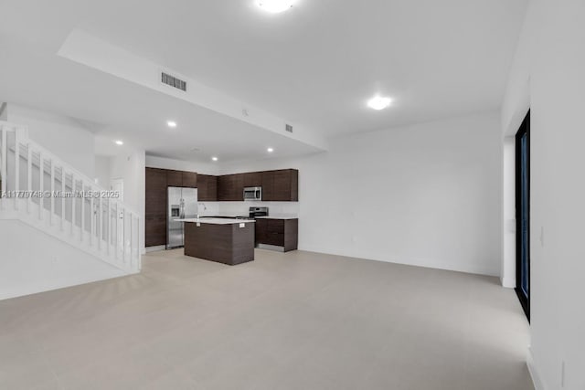34441 SW 189th Ct, Homestead, FL 33034 - unfurnished living room with stairway and recessed lighting