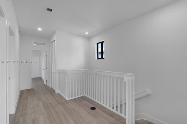 34441 SW 189th Ct, Homestead, FL 33034 - hall with an upstairs landing, wood finished floors, recessed lighting, and baseboards