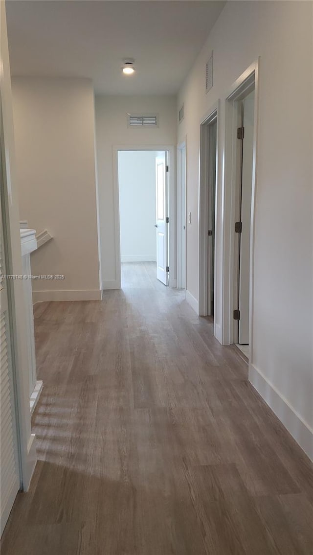 34441 SW 189th Ct, Homestead, FL 33034 - hallway featuring wood finished floors and baseboards