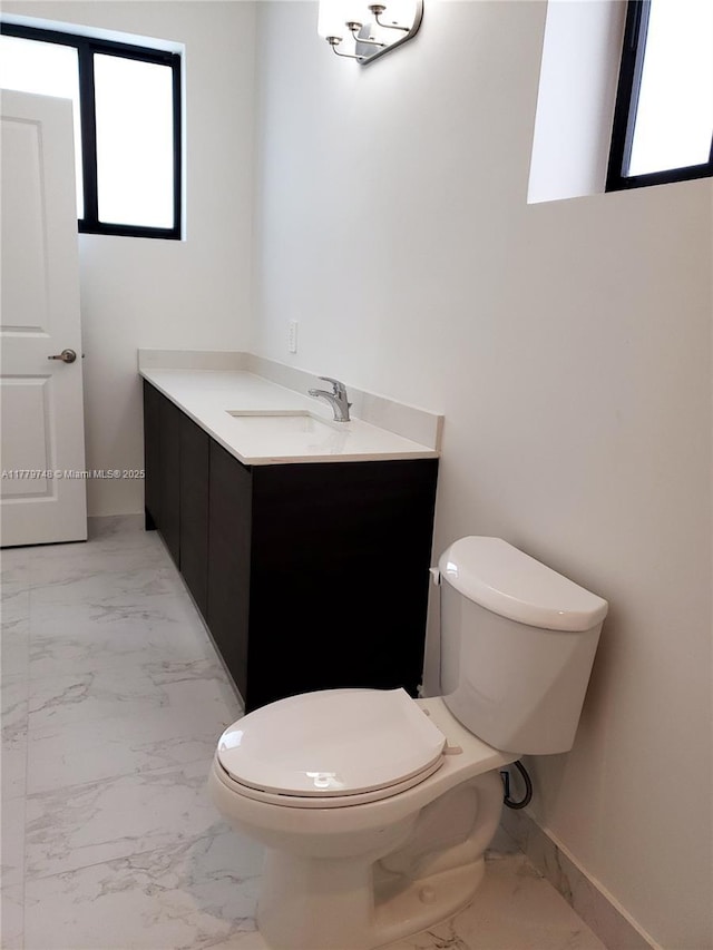 34441 SW 189th Ct, Homestead, FL 33034 - bathroom with marble finish flooring, vanity, and toilet