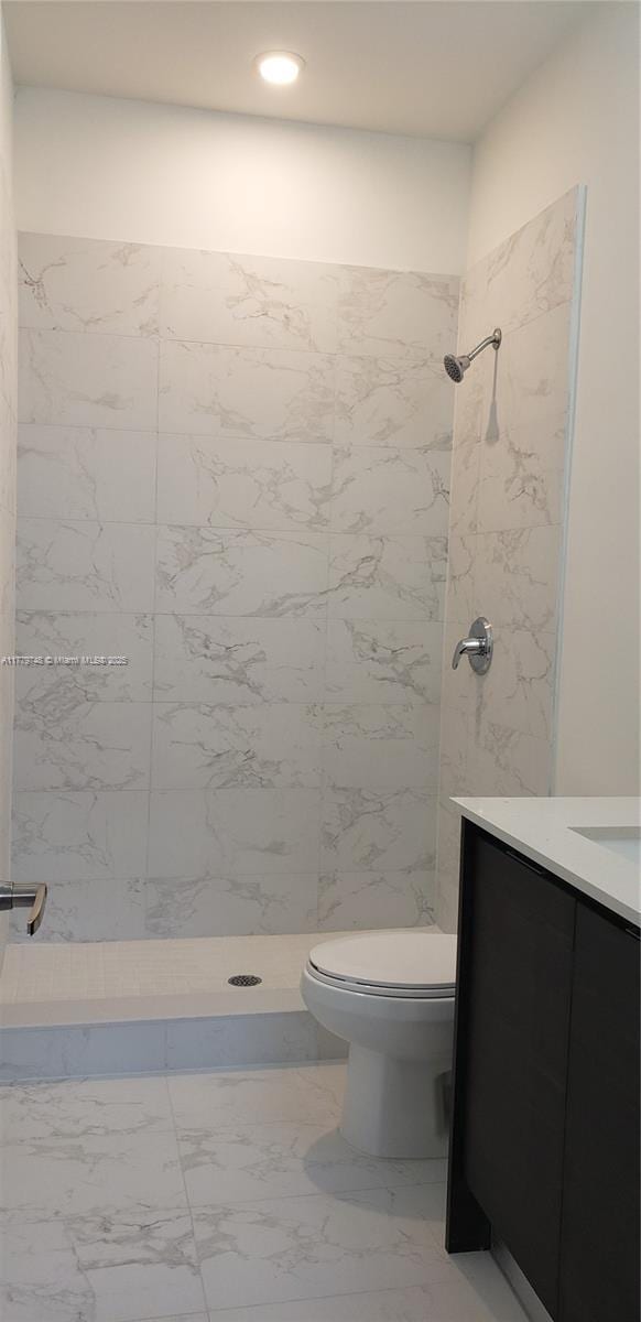 34441 SW 189th Ct, Homestead, FL 33034 - bathroom with toilet, vanity, a shower stall, marble finish floors, and recessed lighting
