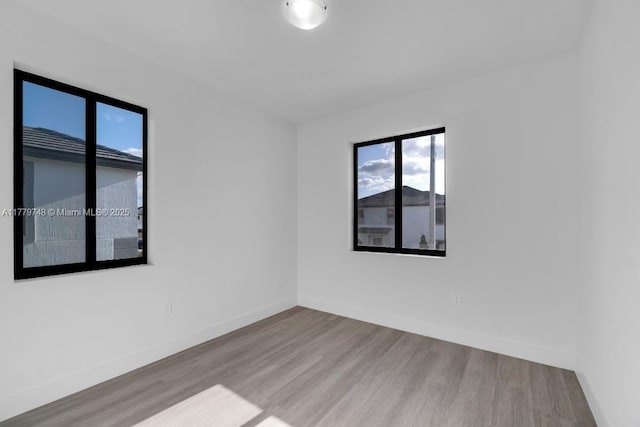 34441 SW 189th Ct, Homestead, FL 33034 - spare room featuring wood finished floors and baseboards