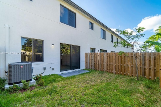 34441 SW 189th Ct, Homestead, FL 33034 - back of property with central AC unit and stucco siding