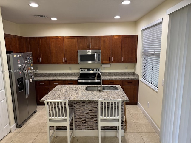 4849 NW 57th Ct, Tamarac, FL 33319 - kitchen featuring a sink, light tile patterned floors, visible vents, and stainless steel appliances