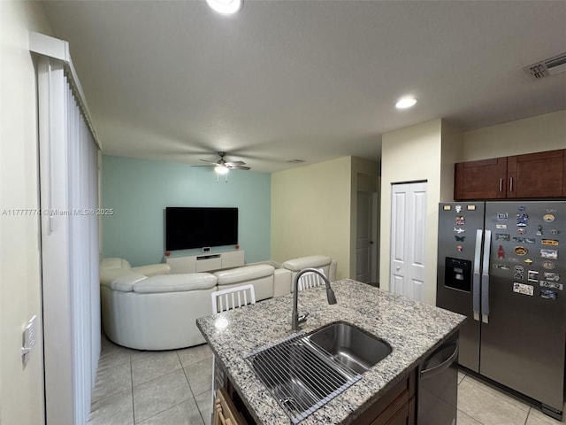 4849 NW 57th Ct, Tamarac, FL 33319 - kitchen with light tile patterned flooring, a sink, visible vents, and stainless steel appliances