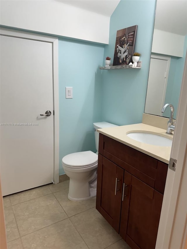 4849 NW 57th Ct, Tamarac, FL 33319 - half bathroom with tile patterned floors, vanity, and toilet