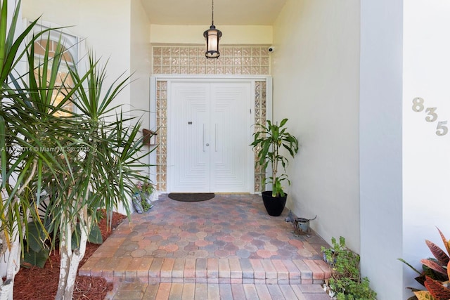 8350 SW 138th Ter, Palmetto Bay, FL 33158 - doorway to property featuring stucco siding