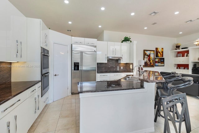 8350 SW 138th Ter, Palmetto Bay, FL 33158 - kitchen with tasteful backsplash, white cabinetry, visible vents, stainless steel appliances, and a sink