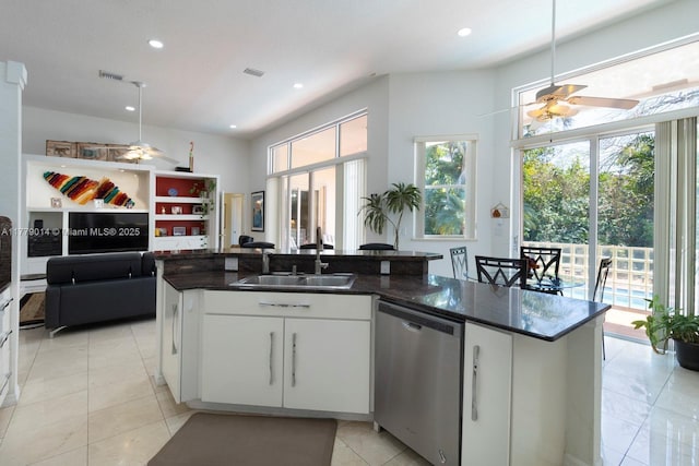 8350 SW 138th Ter, Palmetto Bay, FL 33158 - kitchen featuring white cabinets, a kitchen island with sink, ceiling fan, stainless steel dishwasher, and a sink