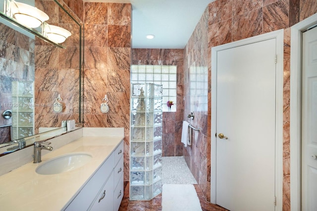 8350 SW 138th Ter, Palmetto Bay, FL 33158 - full bathroom featuring a walk in shower, vanity, and tile walls