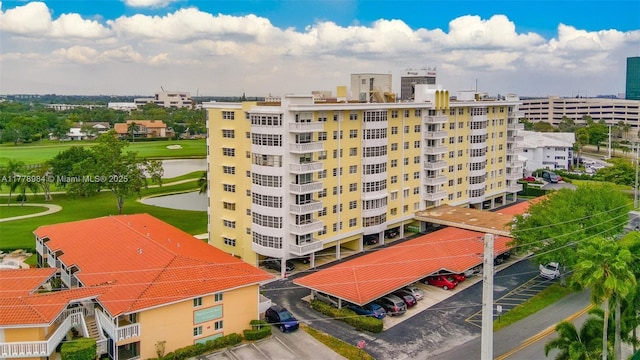 2500 NE 48th Ln Unit 802, Fort Lauderdale, FL 33308 - view of apartment building / complex with uncovered parking and a water view
