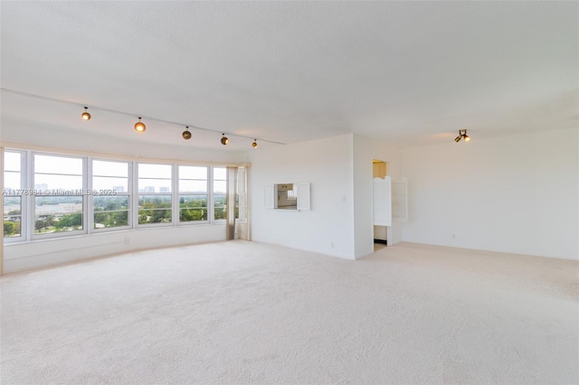 unfurnished living room with carpet flooring