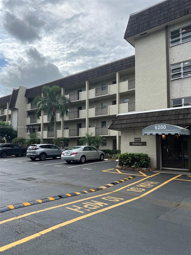 6200 NW 44th St Unit 204, Lauderhill, FL 33319 - view of building exterior featuring uncovered parking