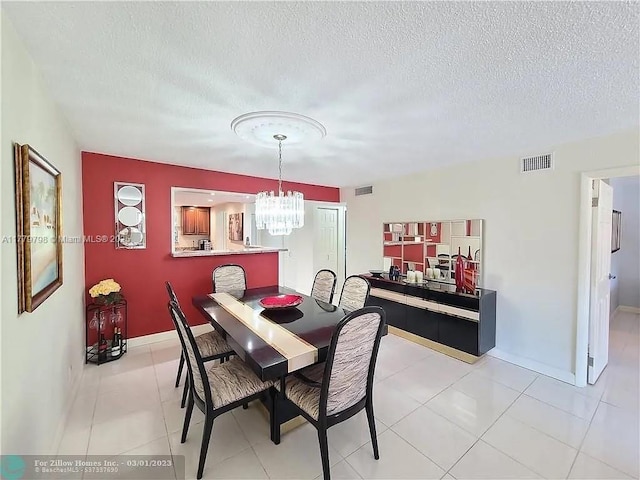 6200 NW 44th St Unit 204, Lauderhill, FL 33319 - dining space with baseboards, a notable chandelier, a textured ceiling, and visible vents