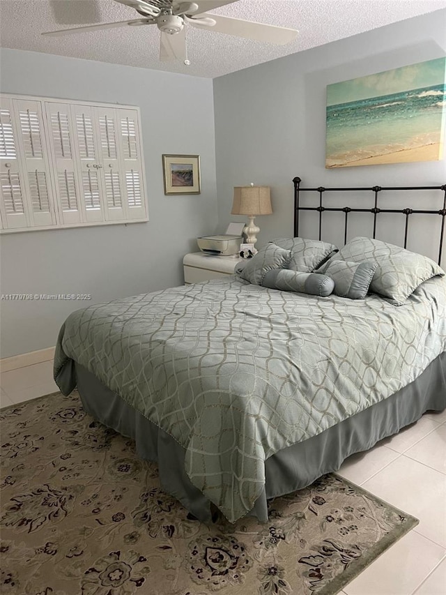 6200 NW 44th St Unit 204, Lauderhill, FL 33319 - tiled bedroom featuring a textured ceiling and ceiling fan