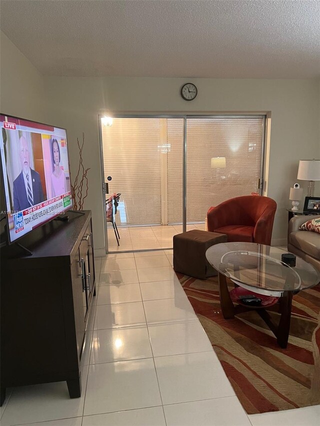 6200 NW 44th St Unit 204, Lauderhill, FL 33319 - living room featuring light tile patterned flooring and a textured ceiling