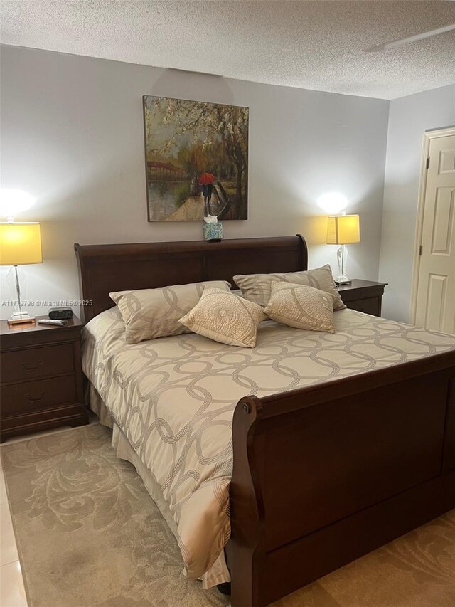 6200 NW 44th St Unit 204, Lauderhill, FL 33319 - bedroom with a textured ceiling and light colored carpet