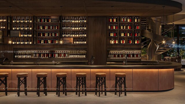 1210 Brickell Ave Unit 4804, Miami, FL 33131 - wine area with finished concrete flooring and wet bar