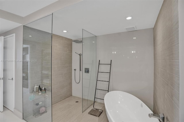 300 Sunny Isles Blvd Unit 4-903, Sunny Isles Beach, FL 33160 - bathroom featuring walk in shower, a freestanding bath, tile walls, and recessed lighting