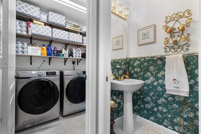 washroom with tile patterned floors, separate washer and dryer, laundry area, and wallpapered walls