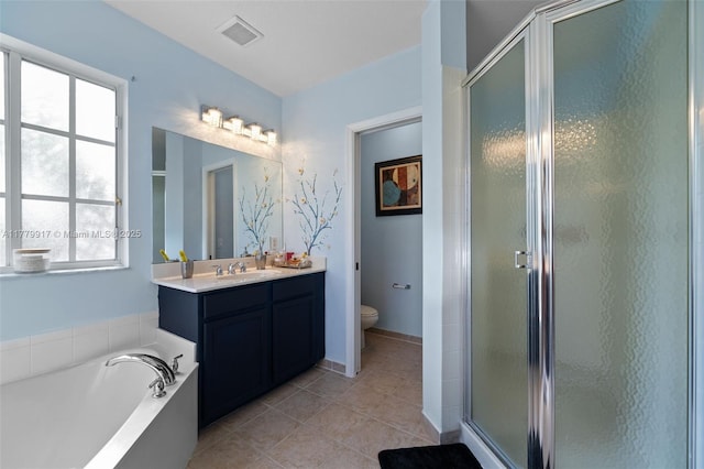 bathroom with a shower stall, toilet, visible vents, and a wealth of natural light