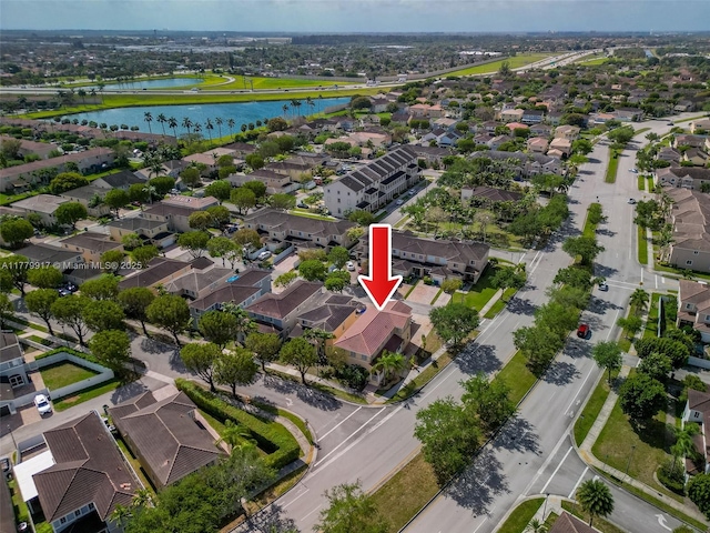 aerial view with a residential view and a water view
