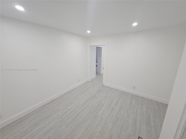 unfurnished room featuring light wood-type flooring, recessed lighting, and baseboards
