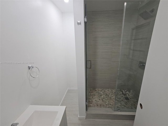 full bath featuring vanity and a stall shower
