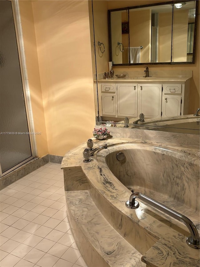 1865 S Ocean Dr Unit 3F, Hallandale Beach, FL 33009 - full bathroom with tile patterned flooring, vanity, a bath, baseboards, and an enclosed shower