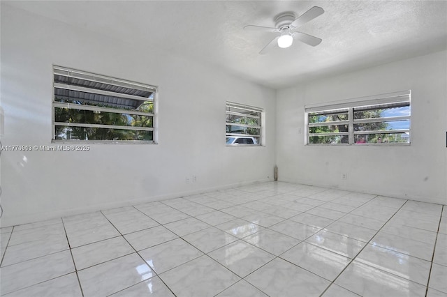 2001 N 26th Ave, Hollywood, FL 33020 - spare room with a textured ceiling, ceiling fan, and light tile patterned floors