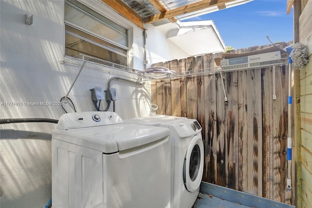 2001 N 26th Ave, Hollywood, FL 33020 - laundry area featuring washer and dryer and wooden walls