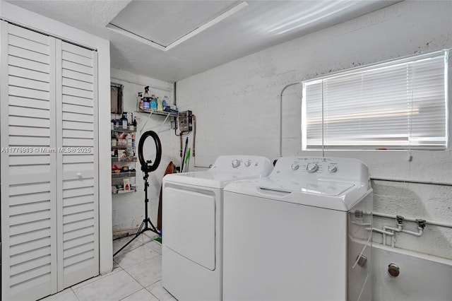 2001 N 26th Ave, Hollywood, FL 33020 - washroom featuring washing machine and dryer and light tile patterned floors