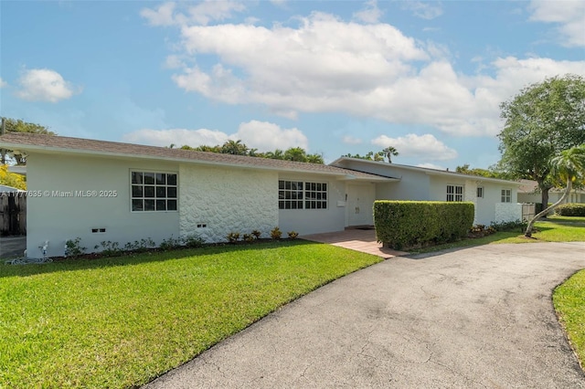 13925 SW 74th Ave, Palmetto Bay, FL 33158 - single story home with aphalt driveway, stucco siding, fence, and a front lawn