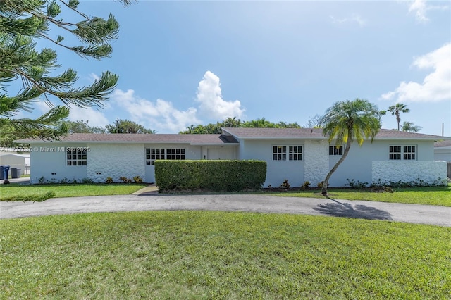 13925 SW 74th Ave, Palmetto Bay, FL 33158 - ranch-style home with a front lawn, aphalt driveway, and stucco siding