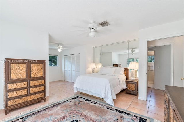 13925 SW 74th Ave, Palmetto Bay, FL 33158 - bedroom with baseboards, light tile patterned floors, ceiling fan, and visible vents