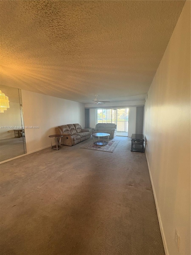 10133 NW 24th Pl Unit 206, Sunrise, FL 33322 - unfurnished living room with a textured ceiling, baseboards, and carpet floors