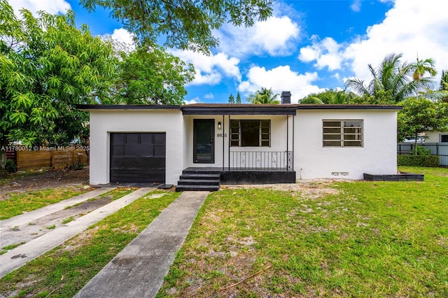 view of front facade featuring a garage, stucco siding, a porch, fence, and concrete driveway