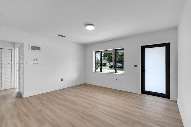 interior space featuring light wood-style flooring and visible vents