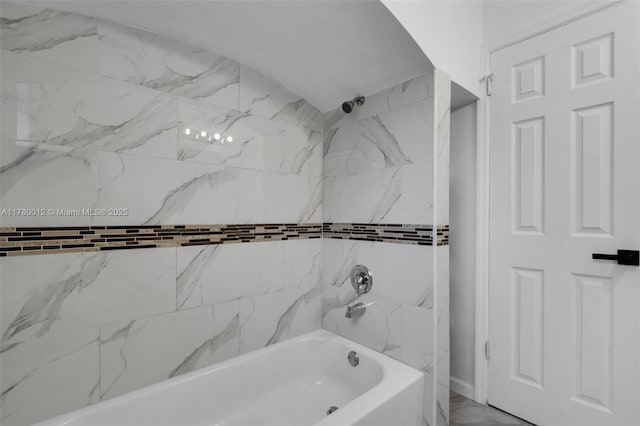 full bath featuring marble finish floor and shower / washtub combination