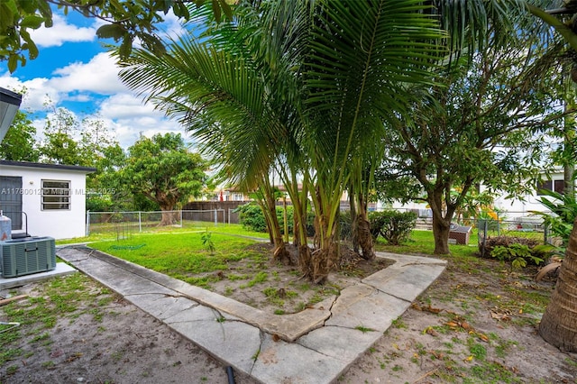 view of yard with a fenced backyard and cooling unit