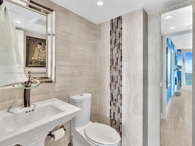 6770 Indian Creek Dr Unit 7K, Miami Beach, FL 33141 - bathroom with tile walls, recessed lighting, and tile patterned floors