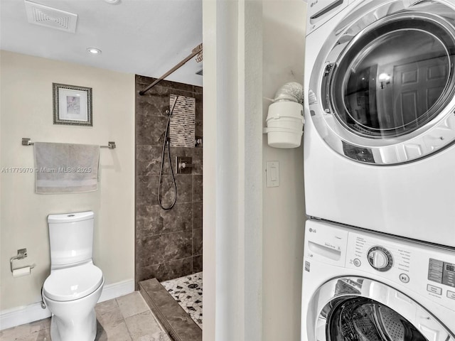 6770 Indian Creek Dr Unit 7K, Miami Beach, FL 33141 - bathroom with stacked washer / drying machine, a shower stall, and recessed lighting