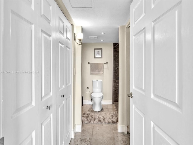 6770 Indian Creek Dr Unit 7K, Miami Beach, FL 33141 - bathroom with baseboards and a textured ceiling