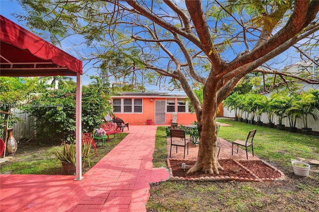 view of yard with a fenced backyard and a patio area