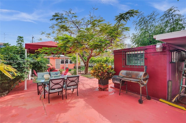 view of patio featuring area for grilling and outdoor dining area